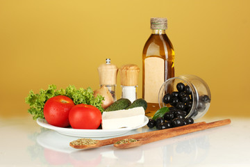 Ingredients for a Greek salad on brown background close-up