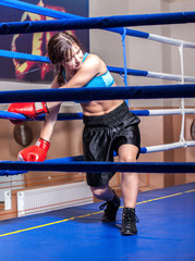 girl boxer in boxing ring