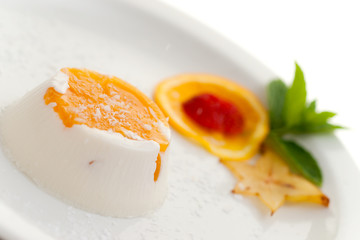 Italian dessert panna cottawith coconit and peach