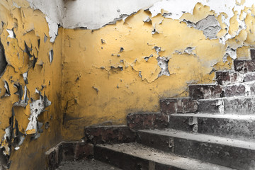 Signs of passing on the walls and stairs in an old abandoned sov