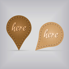 two leather map signs