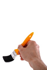 Painter's hand with yellow  brush on white background