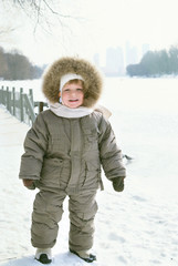 Happy smiling boy in winter clothes