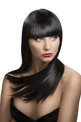 Naklejka premium girl's portrait with long dark hair, she looks at left