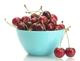 Ripe cherry berries in bowl isolated on white