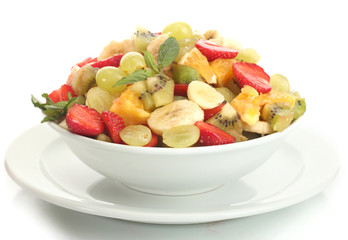 bowl with fresh fruits salad  isolated on white