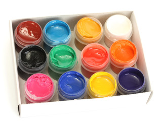 jars with colorful gouache in paper box