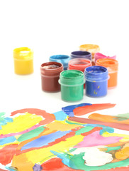 Jars with colorful gouache with a bright picture close-up