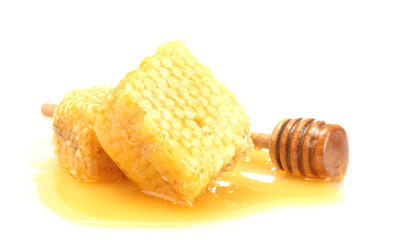 Naklejka na ściany i meble golden honeycombs and wooden drizzler with honey isolated