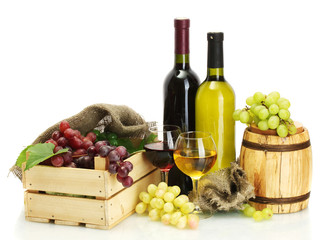 barrel, bottles and glasses of wine and ripe grapes isolated