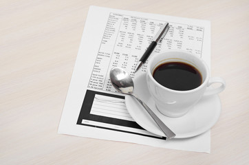 Accounting. Cup of coffee on document. chart and diagram