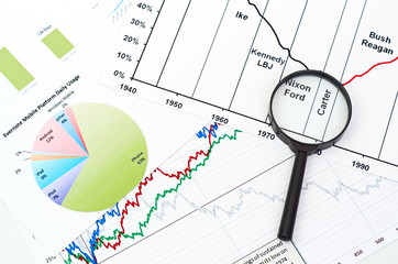 magnifying glass on graph business search background