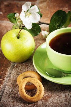 Cup of tea with an apple