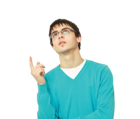 Portrait of a happy young man pointing at something