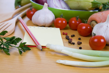 Fresh vegetables and a notebook