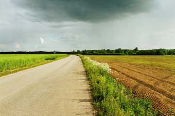 Black cloud above road.
