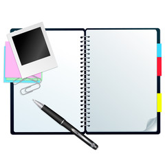 Open notebook with pen, stickers and paperclips