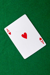 Ace on a green casino table with space for text