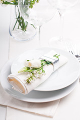 Festive table setting in white