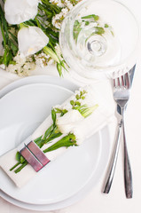 Festive table setting in white