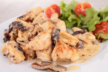 grilled meat with cream and mushrooms