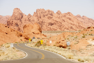 Truck on Curving Road Through Desert
