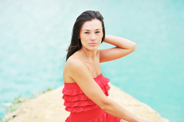 Portrait of a beautiful woman by the sea