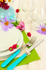 beautiful holiday table setting with flowers