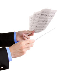 Fototapeta premium Music conductor hands with baton and notes isolated on white