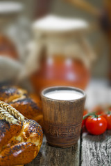 Composition of milk on the bread, the old background