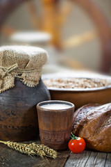Composition of milk on the bread, the old background