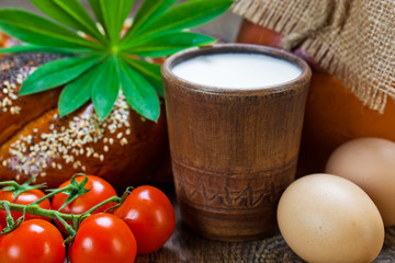 Composition of milk on the bread, the old background