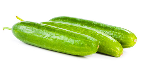 Healthy food. The green cucumbers isolated on white background