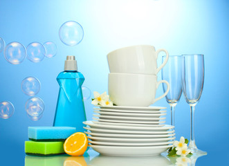 empty clean plates, glasses and cups with dishwashing liquid,
