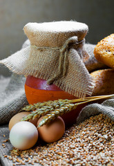 Composition of milk on the bread, the old background