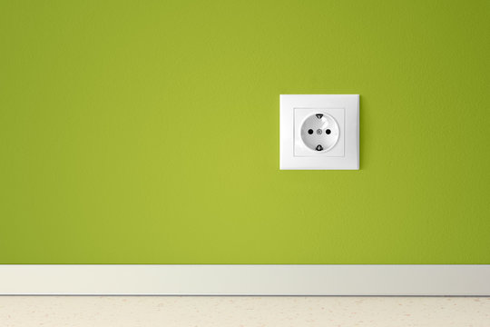 Green wall with european electric outlet