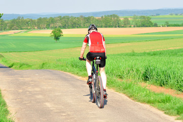 Obraz premium Man riding a bike.