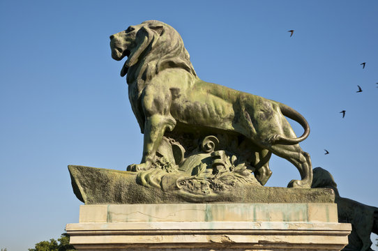Stone lion in Retiro Park, Madrid, Spain
