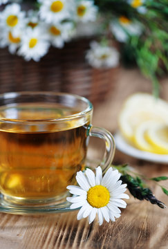 Herbal tea, lemons and herbs in the basket