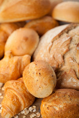 assortment of baked bread on wood table