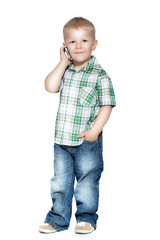 a little boy talking on the phone. isolated on white