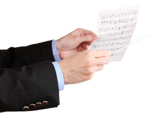 Music conductor hands with baton and notes isolated on white