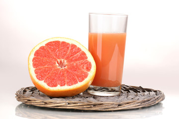 Grapefruit juice and grapefruit isolated on white