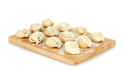 Raw Dumplings on cutting board isolated on white