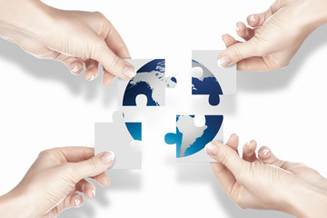 Puzzle pieces and human hand