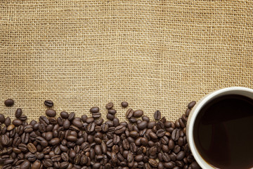 Coffee Beans and Cup over Burlap