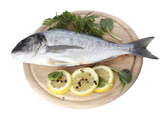 Fresh fish with lemon, parsley and spice