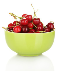 cherry in green bowl isolated on white