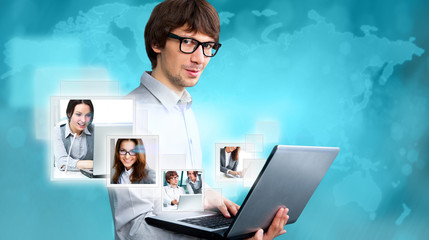 Man using his laptop to communicate his clients and team