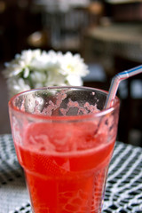 red alcohol cocktail with flowers